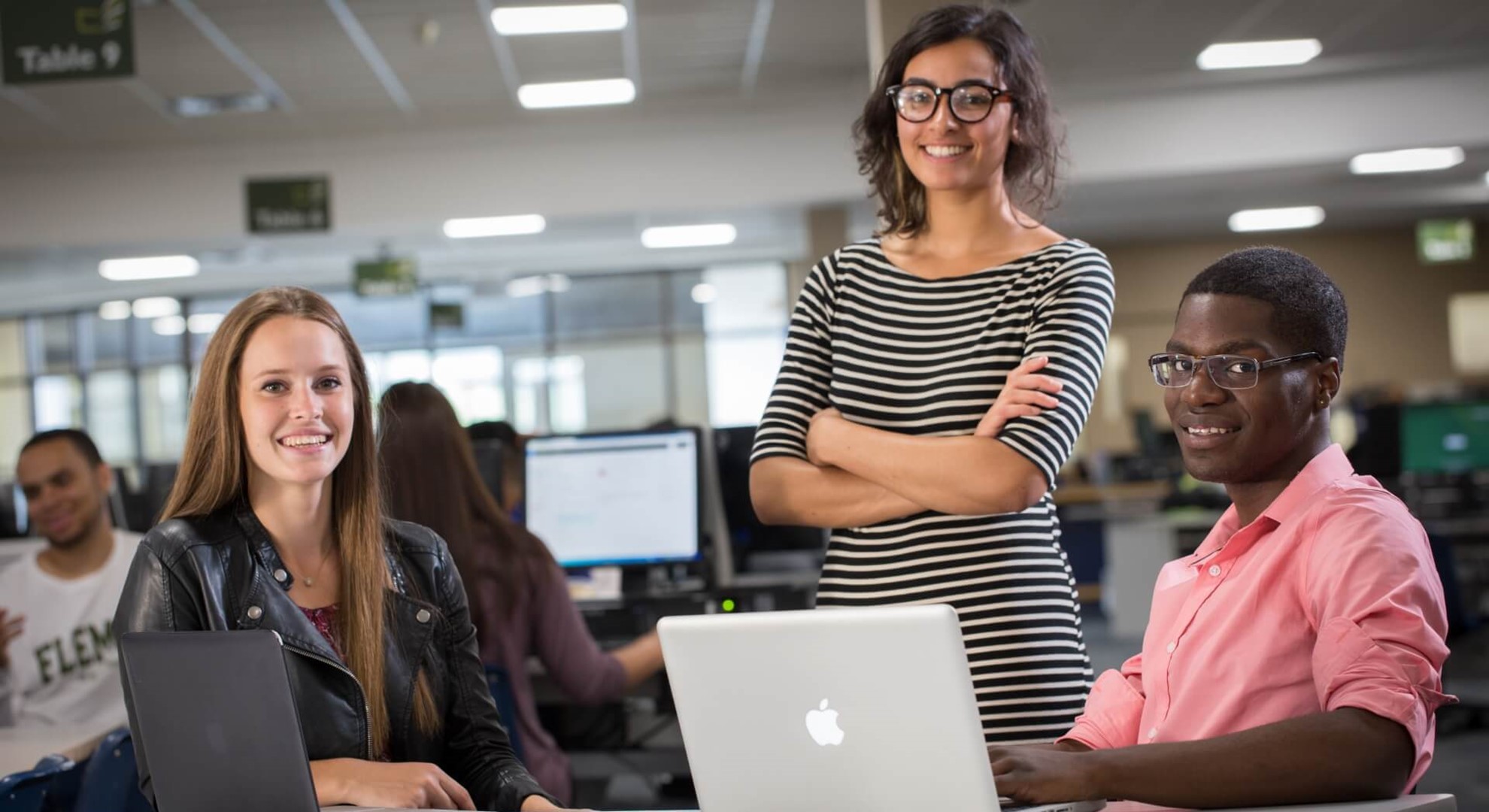 Three women in computer room