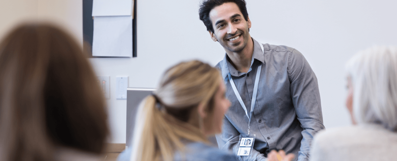 Instructor smiling facing students