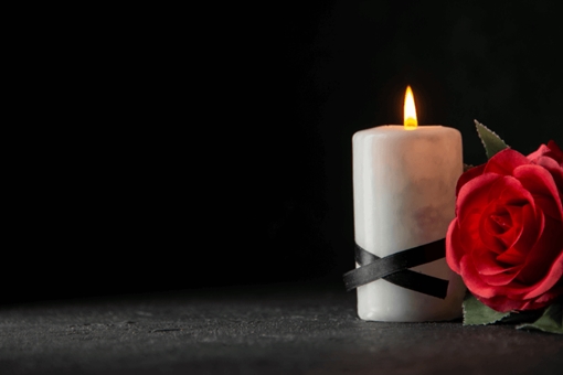 Mourning candle and rose