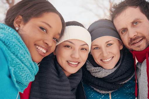 Diverse group smiling in Winter
