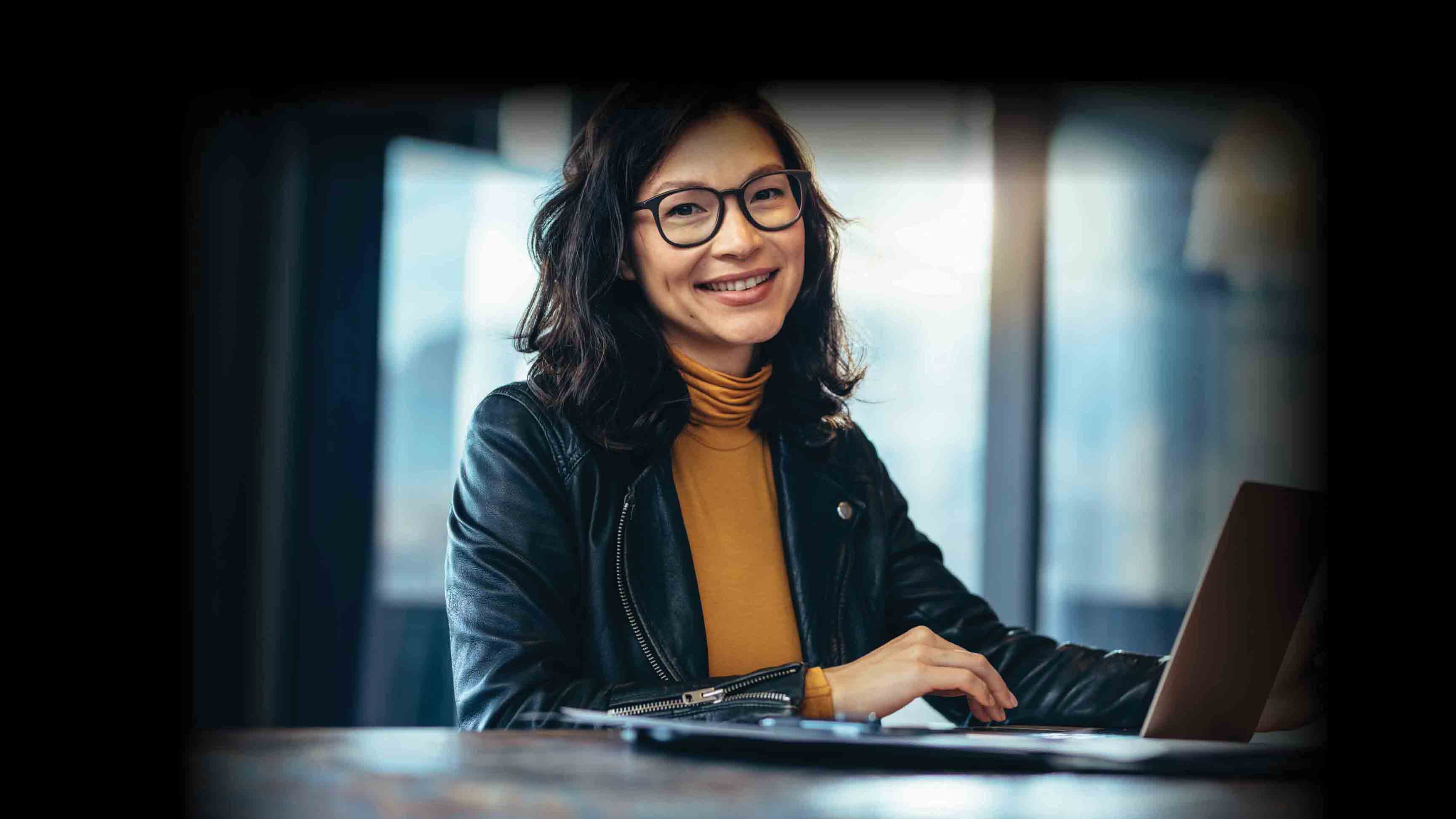 Woman smiling with laptop