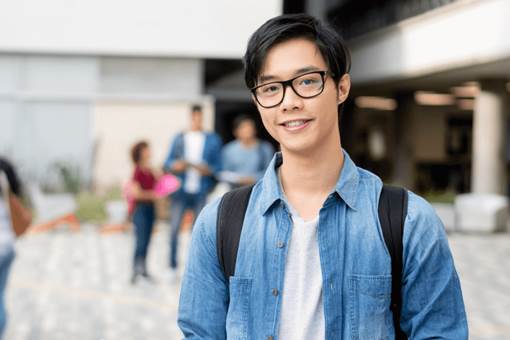 An Asian male student on campus