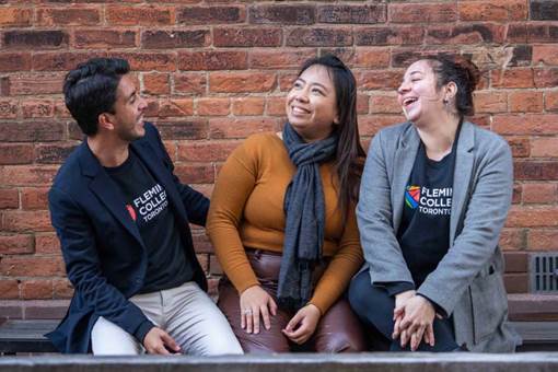 students sitting and laughing